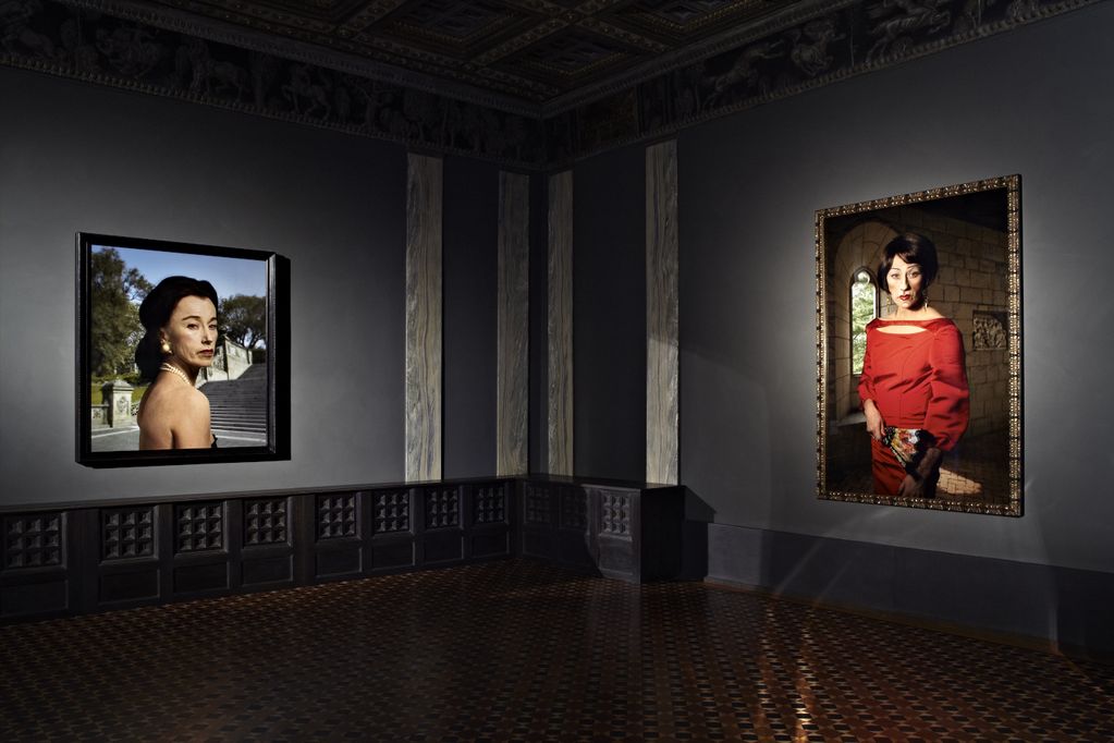 Installation view of two photographic works by the artist Cindy Sherman in a darkened room of the Villa Stuck. The photographs are two self-portraits of the artist as rich women against a prestigious background. Cindy Sherman, Sammlung Goetz Munich