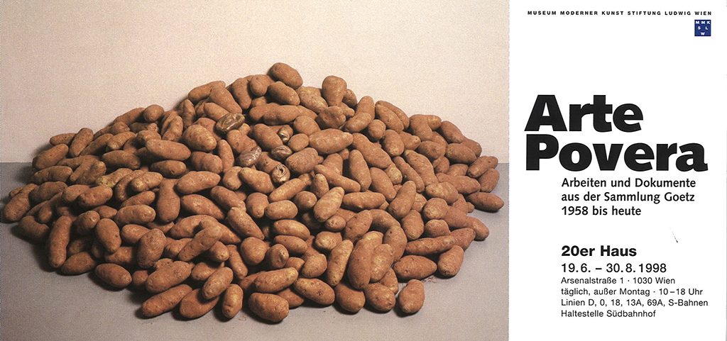 This flyer card for the Arte Povera exhibition consists on the right side mainly of the text announcing the exhibition. The letters are in black and white. However, the largest part of the card is a picture of a potato heap. In this potato heap there are also potatoes which seem to have developed human lips, nose and ears.