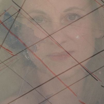 Photo: courtesy Angelika Platen, 2019 A portrait of the artist superimposed with an abstract geometric sketch of red and black parallel and intersecting lines