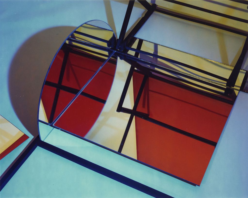 Color photograph of an abstract geometric composition made of mirrors and other objects that cannot be individually identified, Barbara Kasten, Sammlung Goetz, Munich.