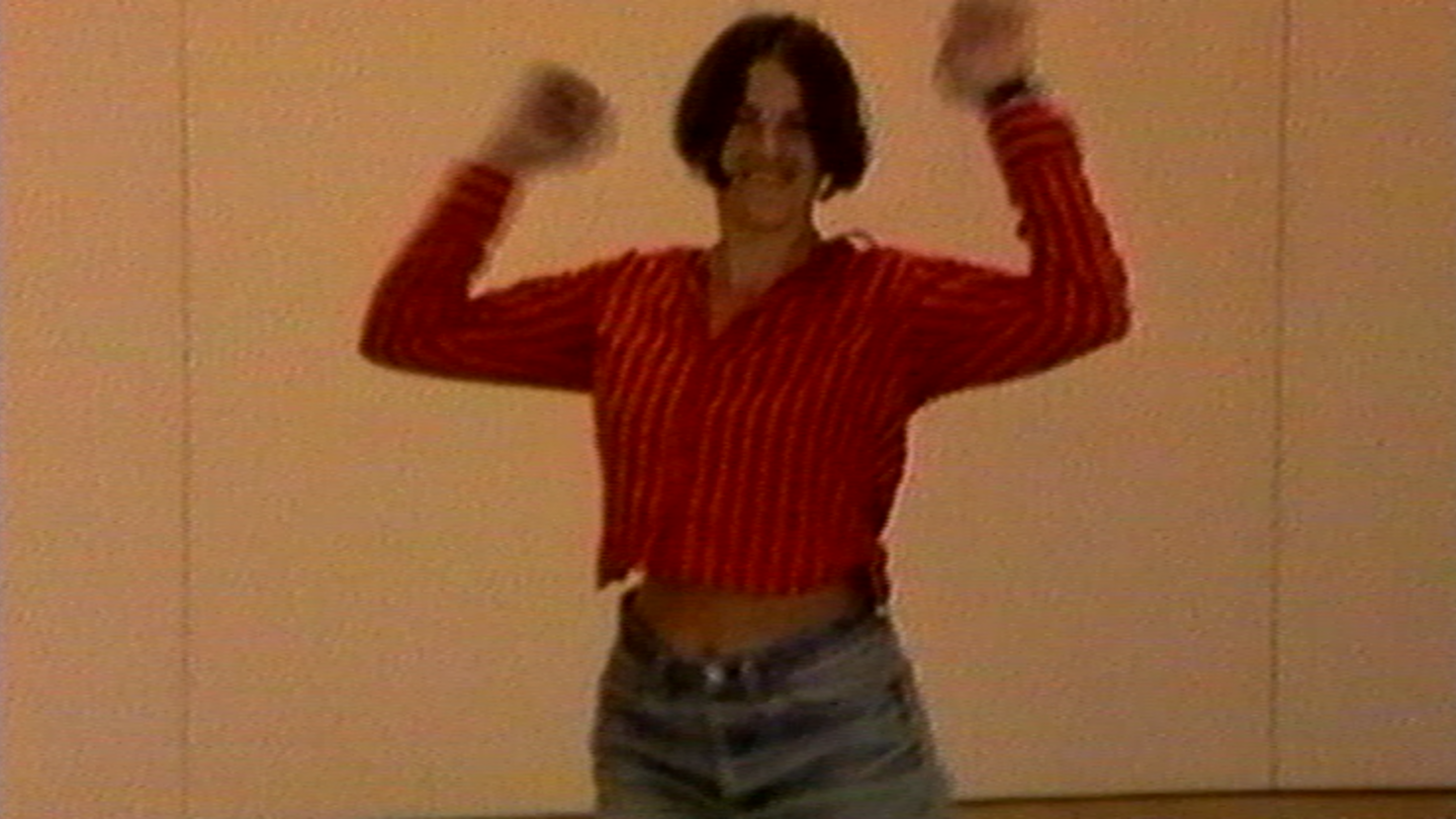 Video Still showing the artist herself dancing in a red blouse and light blue denim shorts. Tracey Emin, Sammlung Goetz Munich