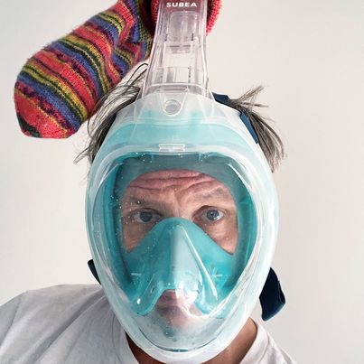 © Bjørn Melhus/VG BILD-KUNST, Bonn  Photography of the artist with diving mask and colorful striped sock pulled over the snorkel, Bjorn Melhus Sammlung Goetz, Munich