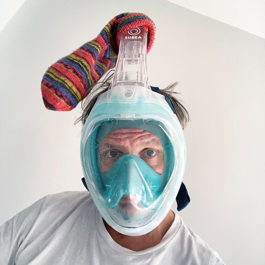 Photography of the artist with diving mask and colorful striped sock pulled over the snorkel, Bjorn Melhus Sammlung Goetz, Munich