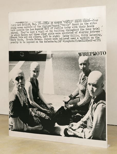 Here you can see a silkscreen print on aluminium. The silkscreen consists of a newspaper cut-out, with a text above a photo of four bald women, who were part of the 'Manson Family'.