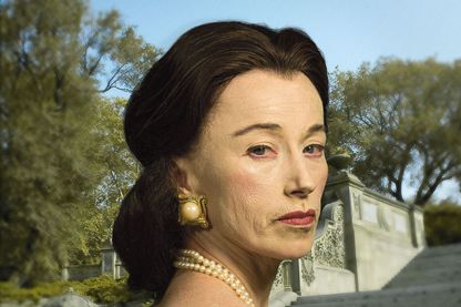 Self-portrait of the artist as an ageing rich lady with brunette, apparently dyed hair, ostentatious jewellery and a bustier dress. The staircase of an old mansion can be seen in the background. Cindy Sherman, Sammlung Goetz Munich